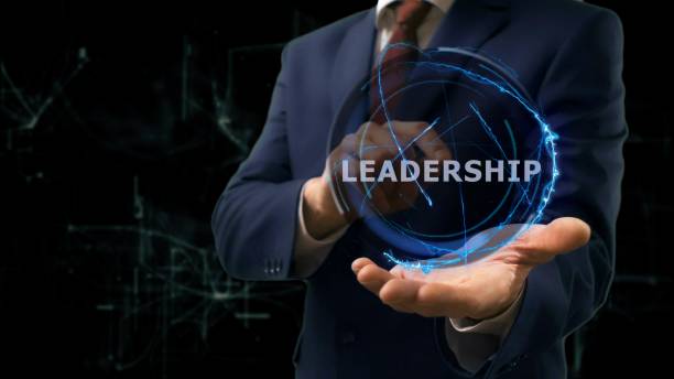 istock Businessman shows concept hologram Leadership on his hand 968057482