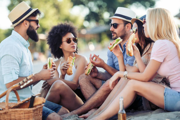 istock Group of friends having fun on the beach 968062450