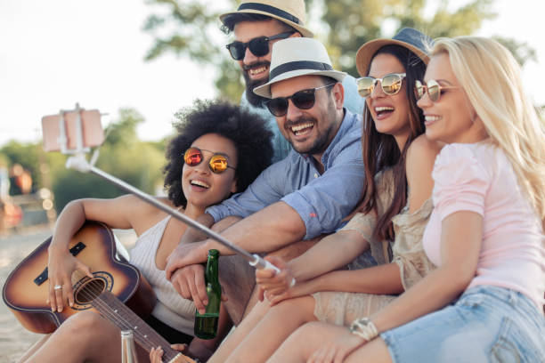 istock Group of friends having fun on the beach 968062512