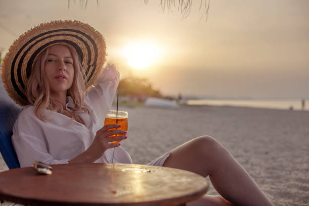istock Young caucasian woman enjoying at the beach 968072668