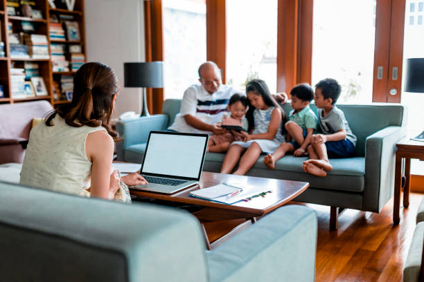istock Chinese mother working from home 968075450