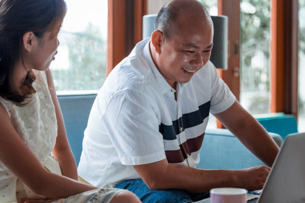 istock Chinese couple working from home 968075460