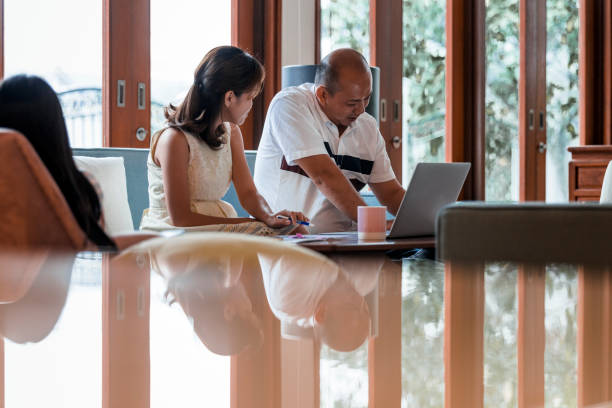 istock Chinese couple working from home 968075468