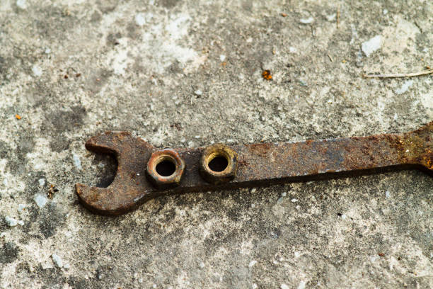 istock Metal nut and key in the garage. Rusty old wrench 968080950