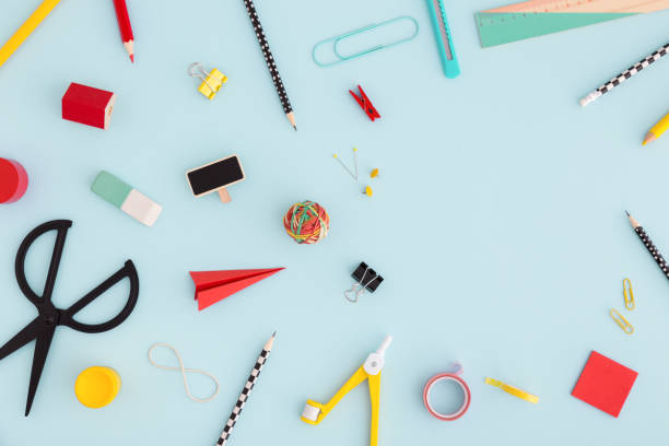 istock Mixed of school on blue table. Flat lay with copy space. 968083558