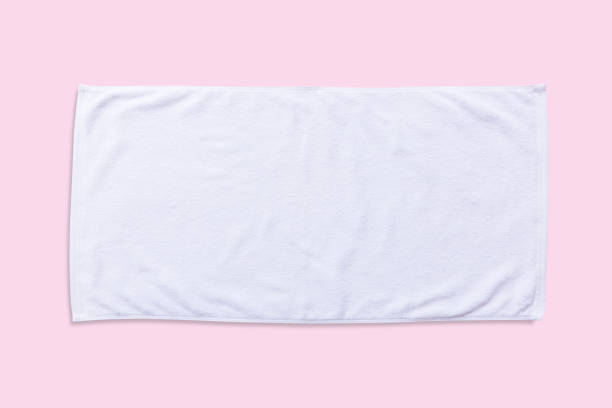 istock White beach towel mock up isolated with clipping path on pastel pink background, flat lay top view 968086312