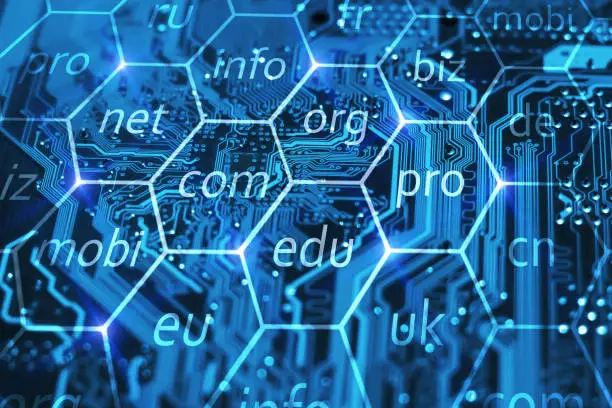 Photo of Internet domain name registration. Online url address for business company. Com, biz, info, edu and other domains in hexes on integrated circuit.