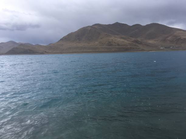 Lake Yamdrok on Cloudy Spring Day in Tibet, China.