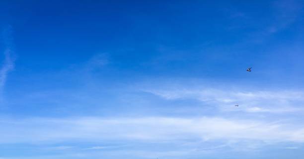 istock Beautiful clouds against a blue sky background. Cloud sky. Blue sky with cloudy weather, nature cloud. White clouds, blue sky and sun. 968189598