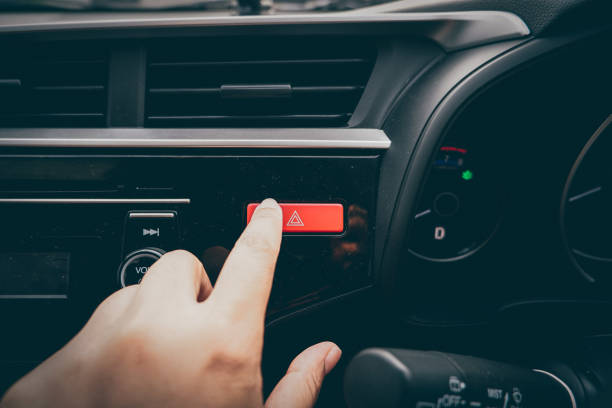 istock Close-up Of Man's Hand Pressing Emergency Button In Car 968194810