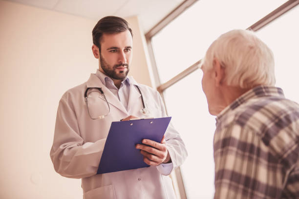 istock Old man and doctor 968197386