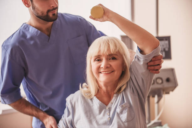 istock Old woman and doctor 968197528
