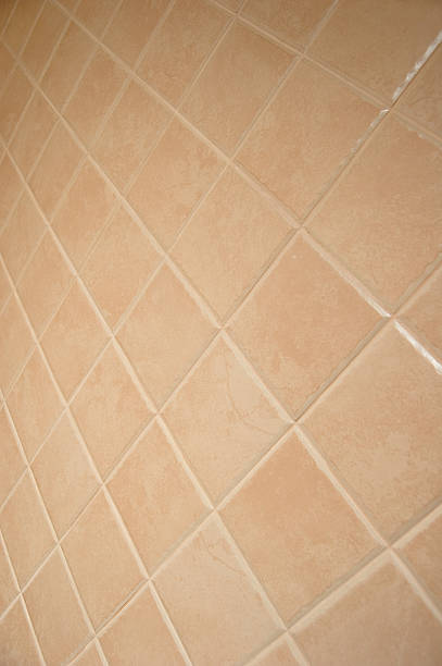 Beige tiled wall stock photo