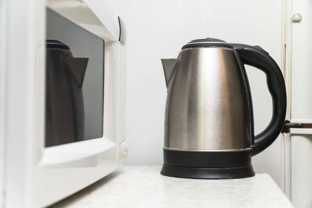 istock Electric kettle and microwave on the kitchen table 968232678