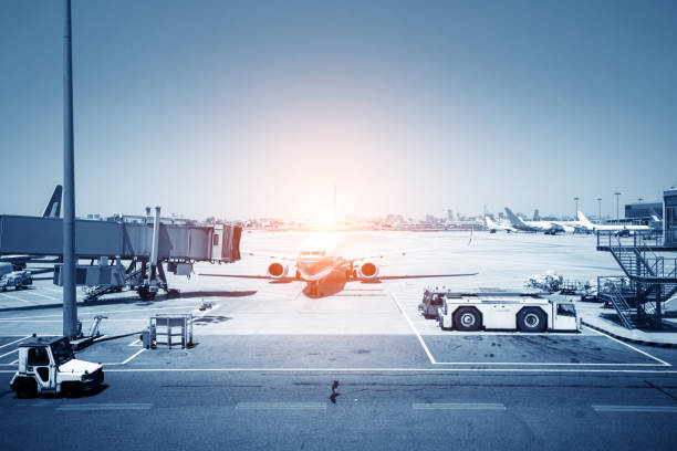 istock Airport with many airplanes at beautiful sunset 968234786