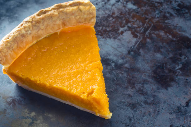 Sweet potato pie on dark background