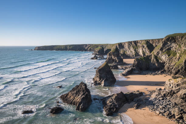 istock Stunning dusk sunset landscape image of Bedruthan Steps on West Cornwall coast in England 968253756