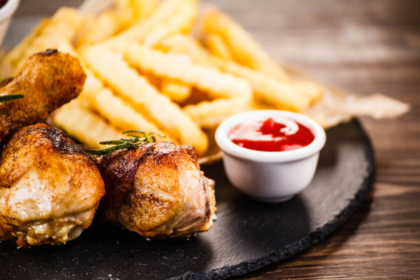istock Fried chicken drumstics with French fries 968254306