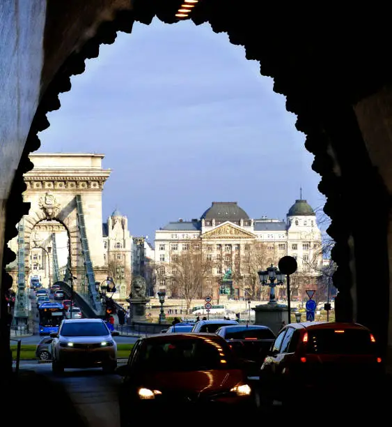 view of the Chain Bridge in Budapest, Hungary from the Buda Tunnel with car traffic