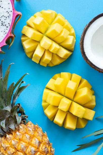 istock Fresh tropical fruits on blue background 968254960
