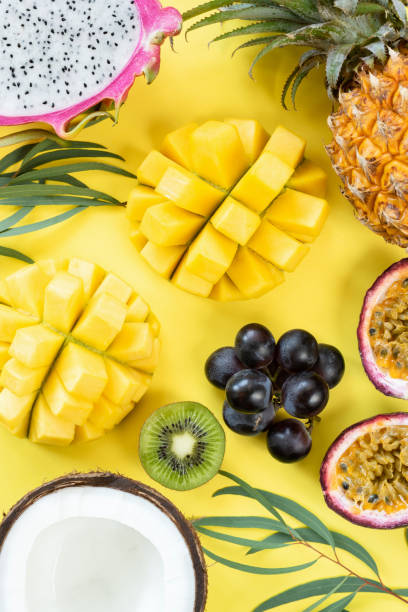istock Fresh tropical fruits on yellow background 968256994