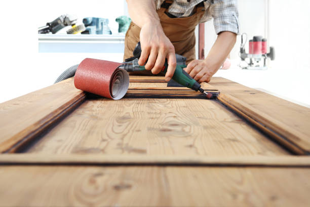 istock carpenter work the wood with the rotary tool 968260118