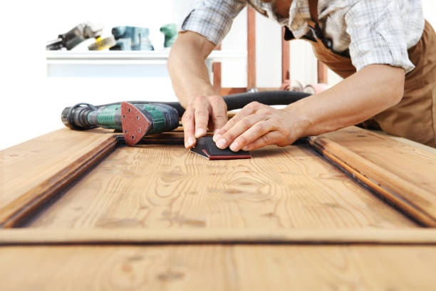 istock carpenter work the wood with the sandpaper 968260120
