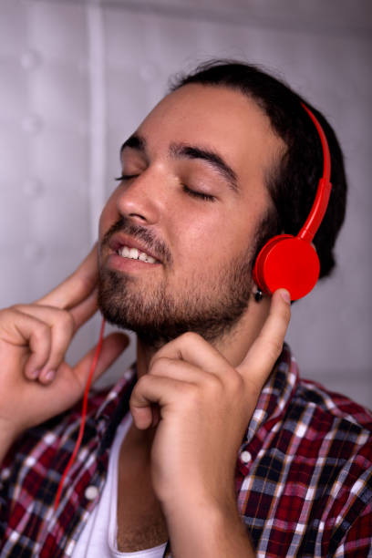 istock Young man wearing headphones 968263220