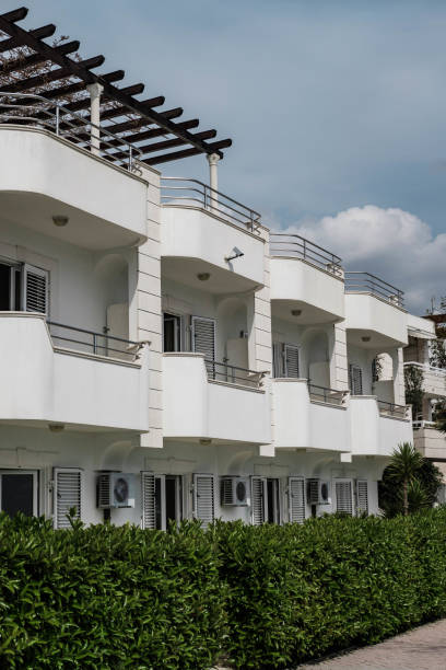 istock Small white houses on the beachfront 968269590