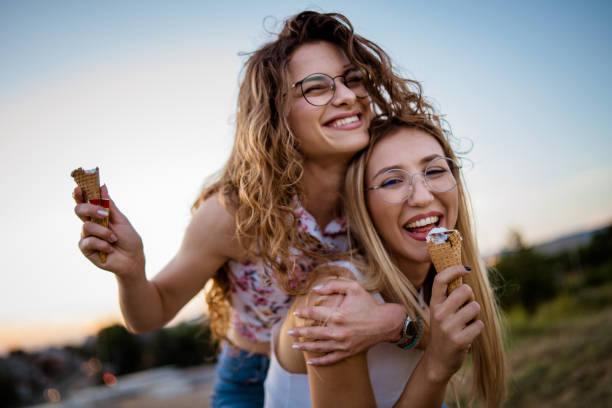 istock Happy women playing piggyback at dusk 968269790