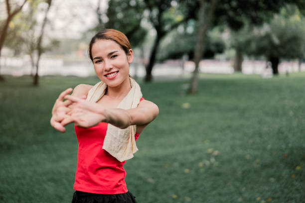istock portrait strength woman stretching bicep muscle. 968275172
