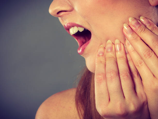 istock Woman suffering from tooth pain 968275384
