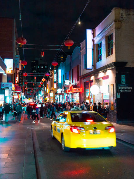 Crowded night in Chinatown, Melbourne Melbourne, Australia - April 27, 2018: Crowd of people at night in the Chinatown. melbourne street crowd stock pictures, royalty-free photos & images