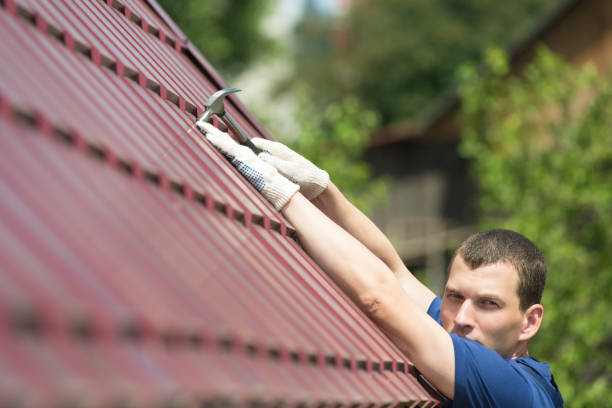 istock the repairman fixes the roof shingles 968278396