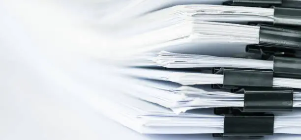 Photo of extremely close up  report paper stacking of office working document