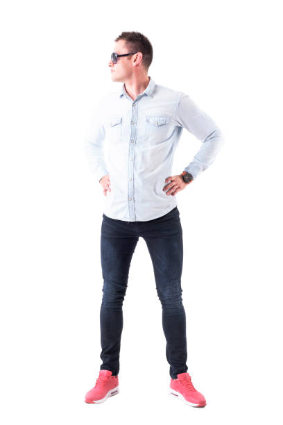 istock Confident serious attitude man with hands on hips wearing sunglasses looking away 968279656