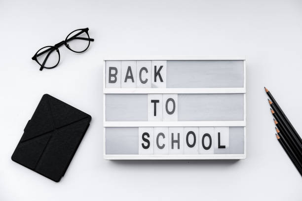 istock Back to School blocks with school supplies on white desk. Top view, flat lay