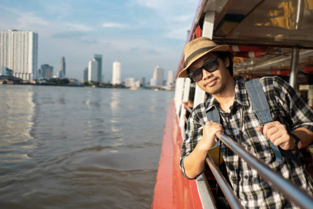 istock Asian man bag pack tourist in travelling at Thailand. 968285564