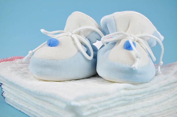 istock Baby Shoes on Cotton Diapers 96828562