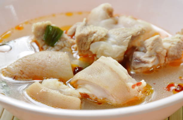 istock spicy boiled pork leg in Tom Yum soup 968285962