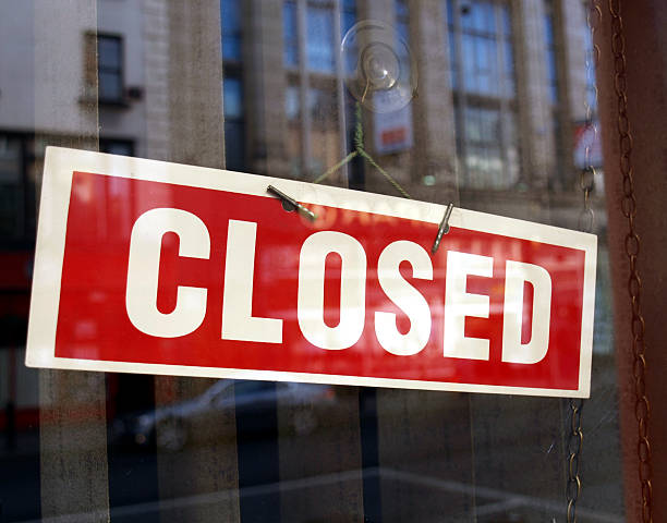 istock A red and white closed sign on a business window 96828811