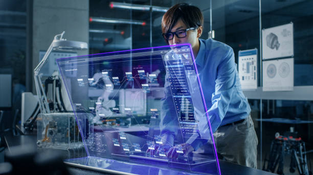 istock Asian Neural Microchip Design Engineer Uses Modern Computer With Transparent Holographic Display. Monitor Shows Advanced Technology Interface . Shot in Modern Glass and Concrete Office. 968289690