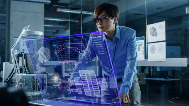 istock Asian Neural Microchip Design Engineer Uses Modern Computer With Transparent Holographic Display. Monitor Shows Advanced Technology Interface. Shot in Modern Glass and Concrete Office. 968289706