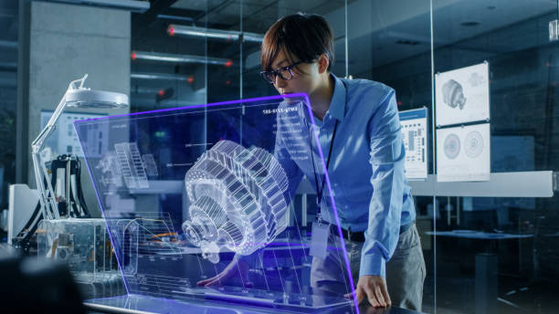 istock Asian Neural Network Engineer Uses Modern Computer With Transparent Holographic Display. Monitor Shows Visualization of a Mechanical Part. Shot in Modern Glass and Concrete Office. 968289718