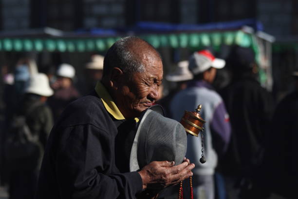 istock Tibetan people praying before Jokhang Temple 968293564