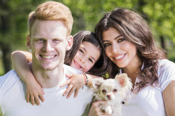 istock Happy family with a dog 968296282