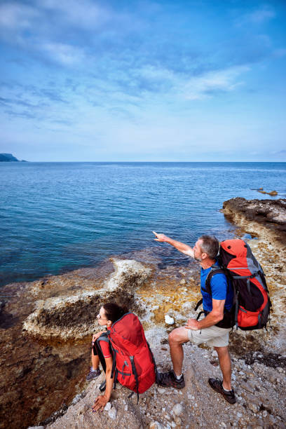 istock Adventure trek along the coast with a backpack in the summer. 968296324
