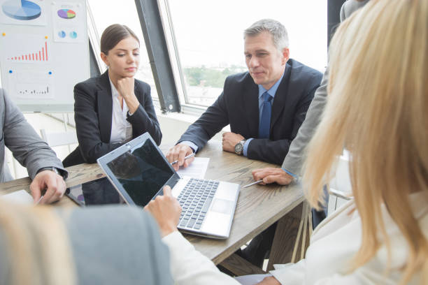 istock Business people work with laptop and financial statistics in office 968296640