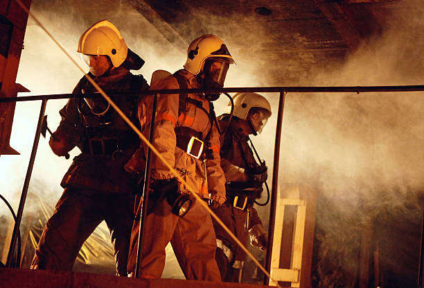 istock Rescue team in uniform inside a smoke-filled room 96830132