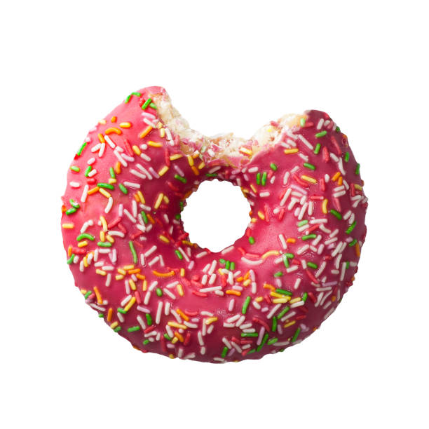 istock Tasty donut with colorful sprinkles isolated on white background. Top view 968306162
